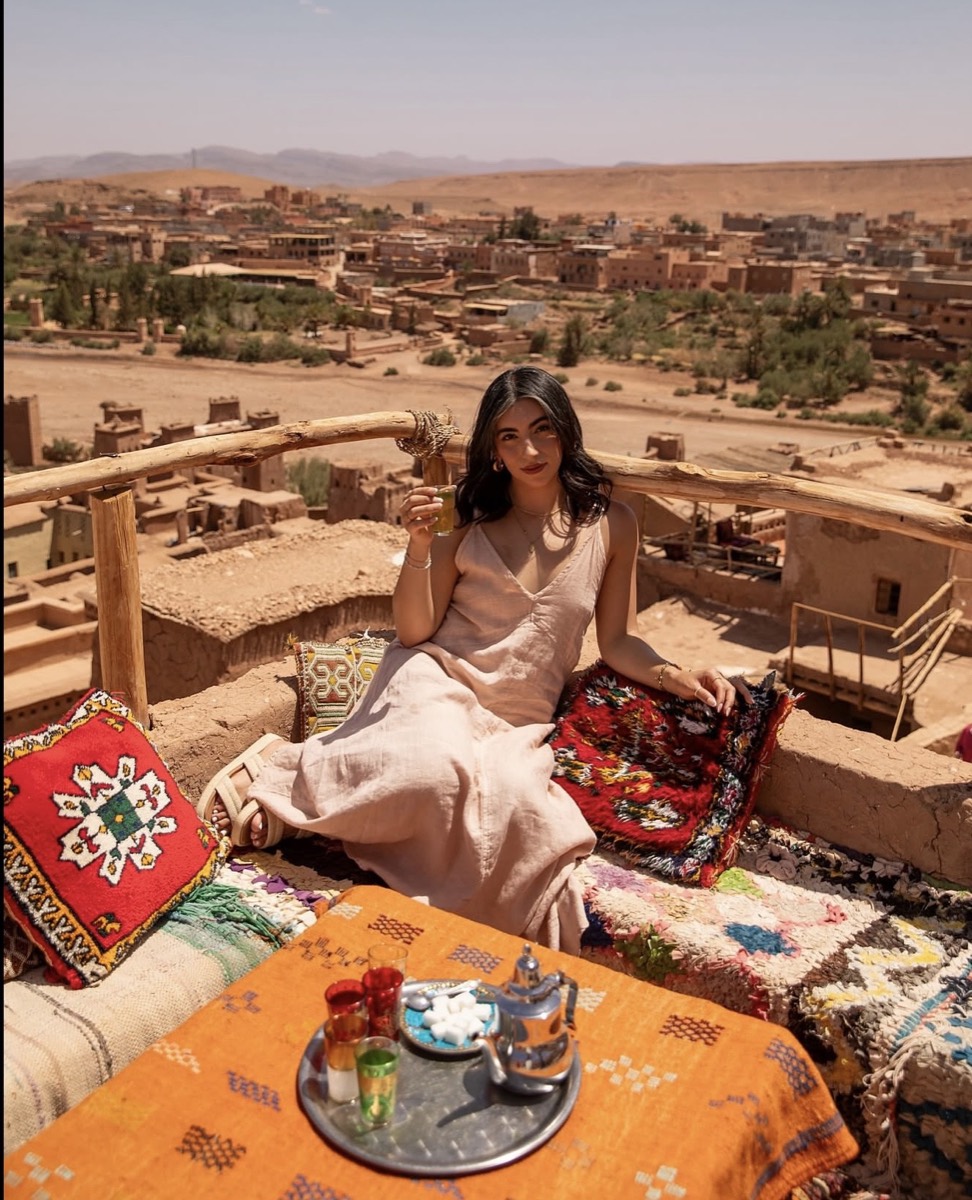 Traveller relaxing on a kasbah terrace in southern Morocco